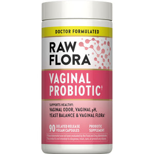 A hand holds a bottle of Vegan Vaginal Probiotic Capsules, featuring 90 delayed-release capsules for gut health and wellness.