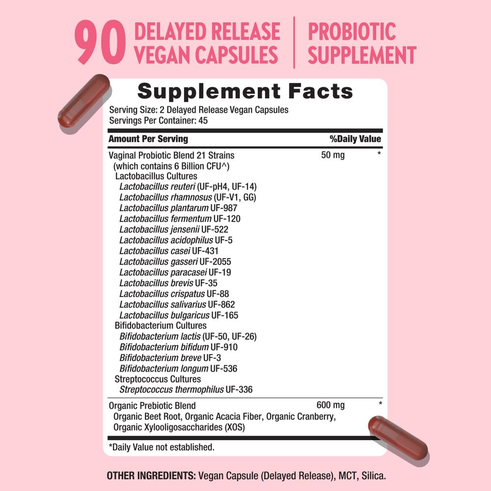 A hand holding two brown delayed release vegan capsules, showcasing the product's unique design and natural formulation.